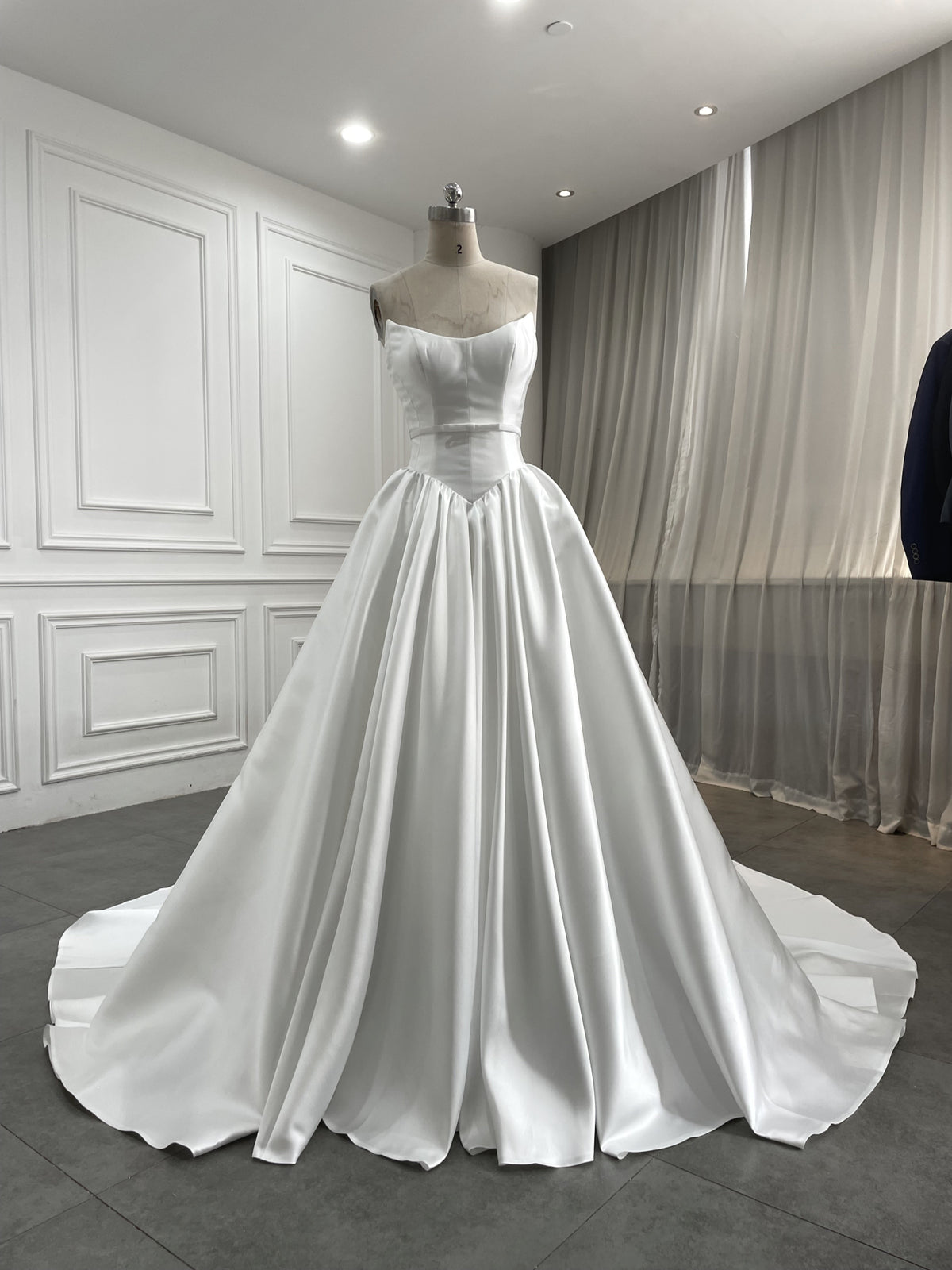Aquamarine strapless satin ball gown with bow belt, front